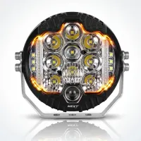 Vue de face du phare LED rond additionnel Next‑Tech 130w 18cm 20000 lumens sur fond studio, feux de jour ambrés allumés