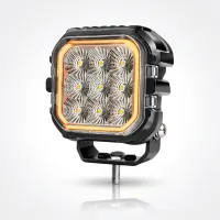 Phare led carré Next‑Tech 45w 10cm 7500 lumens avec feu de jour orange sur fond studio, vue 3/4 éteinte