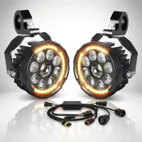 kit de 2 phares LED longue portée ronds Next‑Tech pour moto sur fond studio blanc, halo orange allumé, faisceau et faisceau électrique visibles