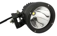 gros plan sur un phare LED rond longue portée 25W Next‑Tech éteint, réflecteur chromé et support de fixation en métal
